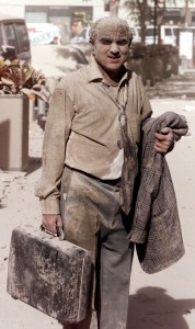 man covered in dust